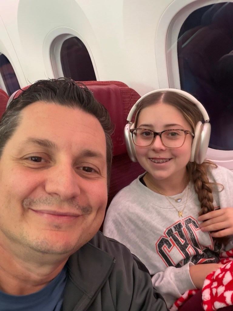 Niko selfie with Kennedy in airplane seats