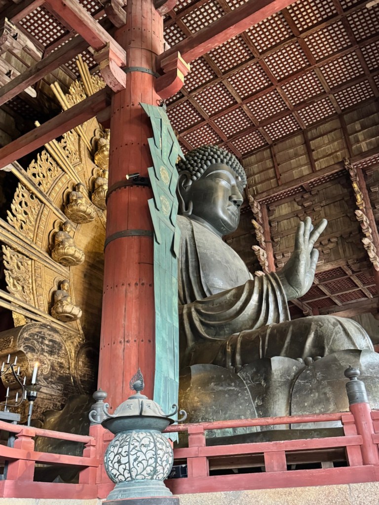 Side view of the Great Buddha inside Todai-ji temple in Nara