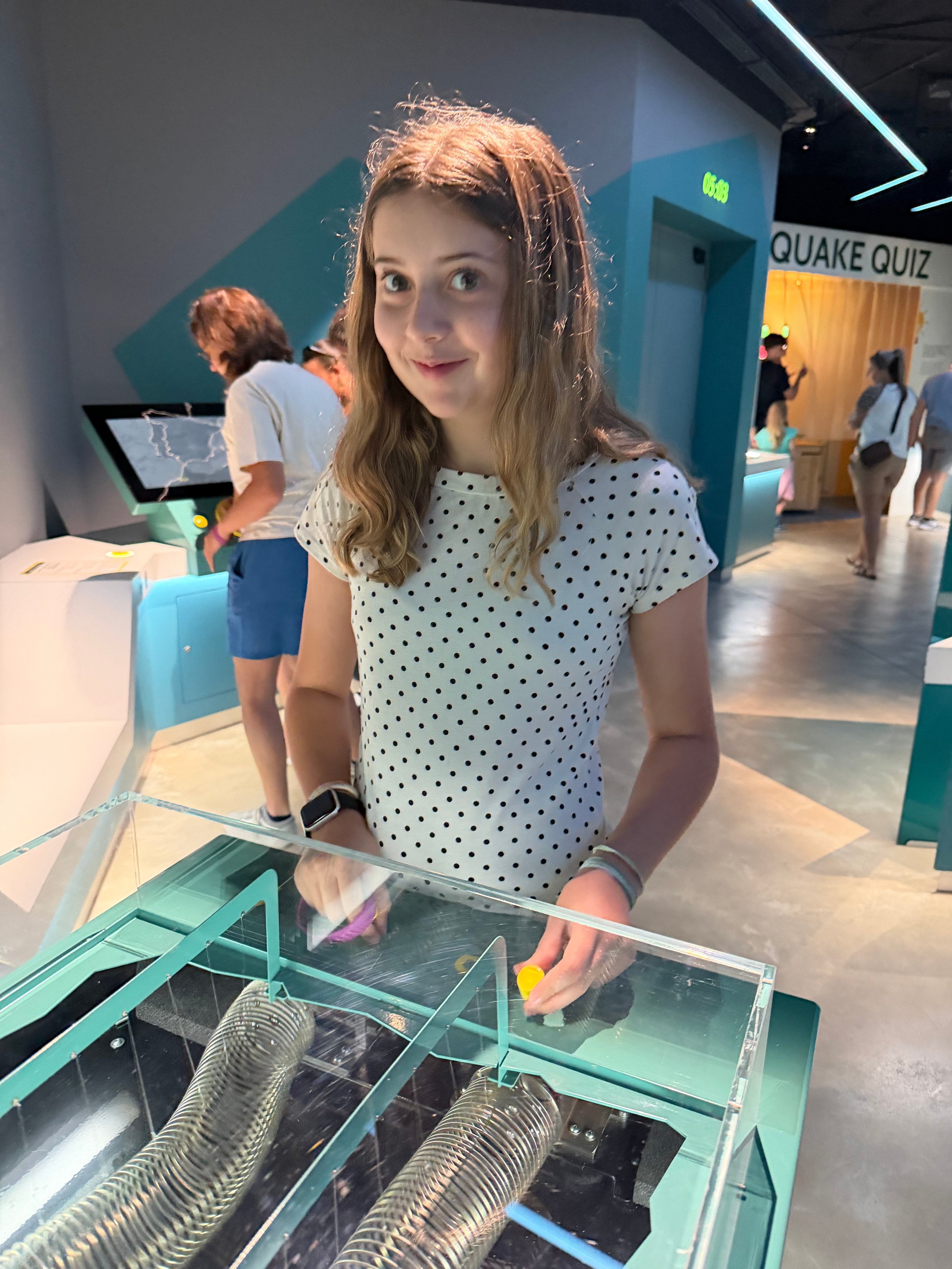 Girl at the Quake Quiz interactive exhibit